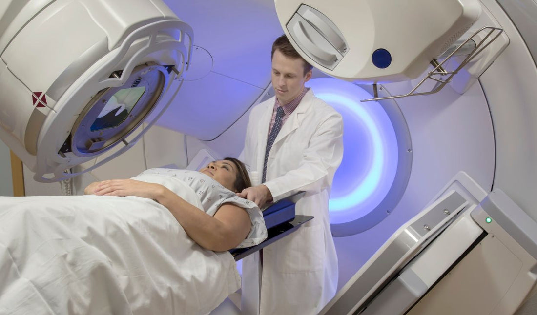 Doctor assisting patient with advanced medical imaging machine in hospital setting