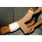 3M Coban self-adherent bandage in flesh color, 10cm x 4.5m, shown in box of 18, used for wound compression and support.