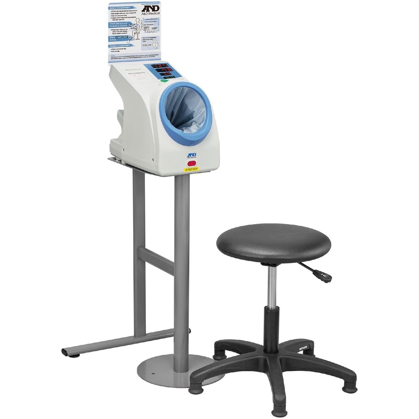 A&D Medical TM-2657P upper arm blood pressure monitor with cuff, designed for waiting room use, displayed on a table.