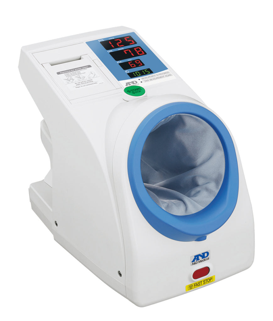 A&D Medical TM-2657P upper arm blood pressure monitor with cuff, displayed in a waiting room setting.