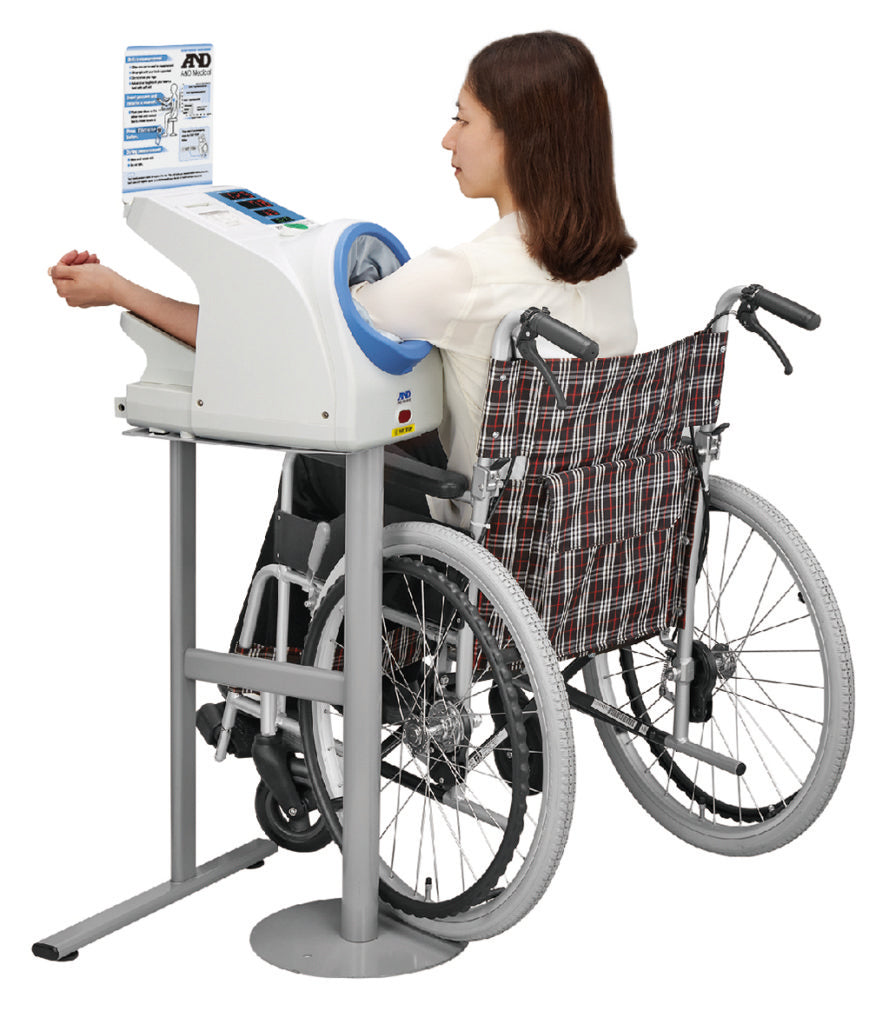 A&D Medical TM-2657P upper arm blood pressure monitor with cuff and display in a waiting room setting