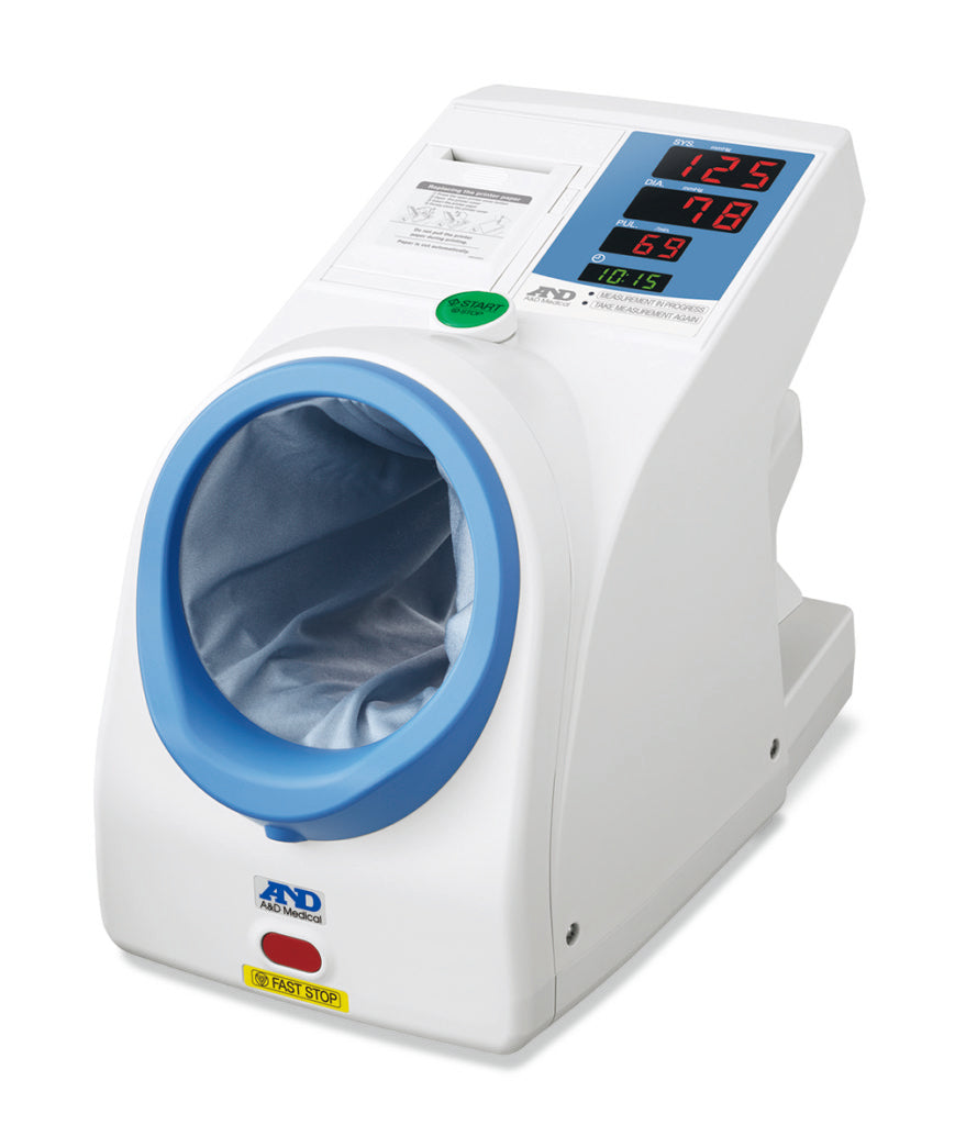 A&D Medical TM-2657P upper arm blood pressure monitor in a waiting room setting, showing the device with display screen and cuff