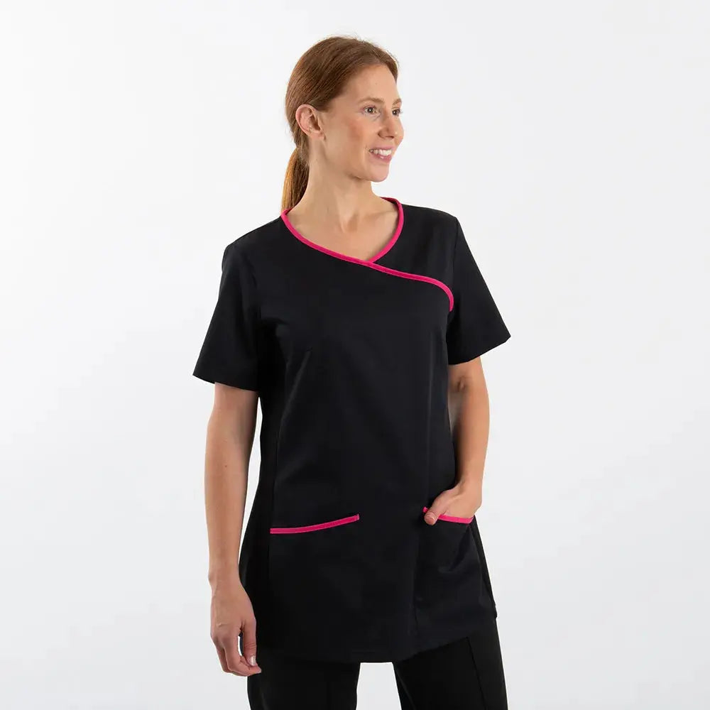 Woman wearing Alexandra women's stretch mock-wrap scrub top, featuring a fitted design and V-neck style.