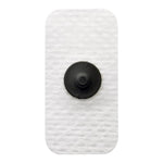 Ambu WhiteSensor paediatric electrode with cloth backing, 19x38mm, shown in case of 300 on a medical surface.