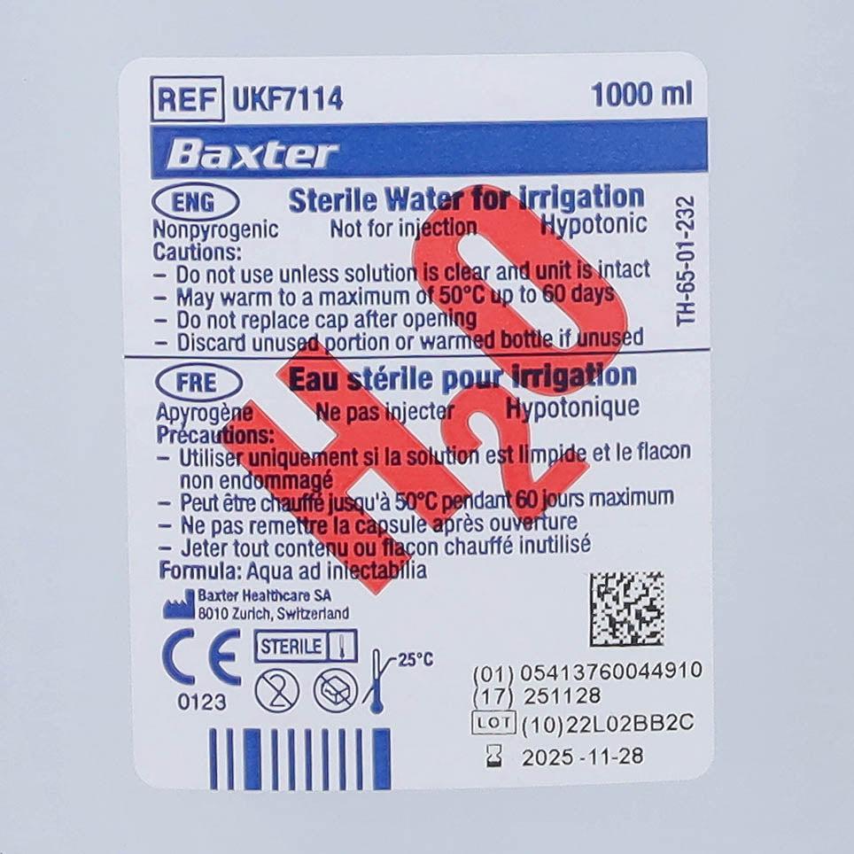 Six 1-liter bottles of Baxter sterile water in clear plastic packaging, suitable for medical or laboratory use.
