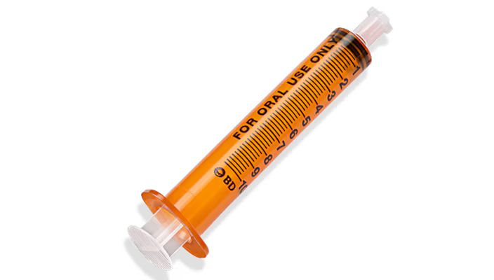 Amber 10ml BD™ oral syringe with tip cap, non-sterile, box of 100, used for precise liquid medication dispensing.