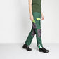 Green medical work trousers with pockets, worn with black slip-resistant shoes
