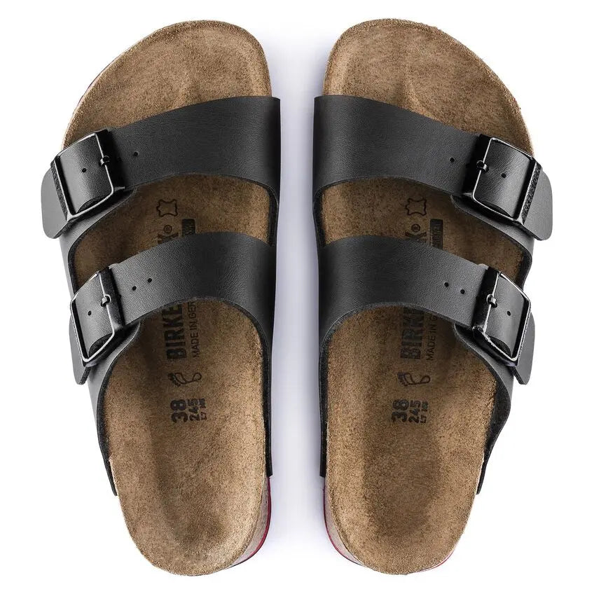 Black double strap sandals with cork footbed and adjustable buckles, top view