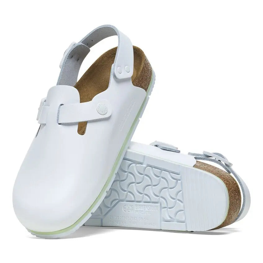 White leather medical clogs with slip-resistant soles and adjustable backstrap