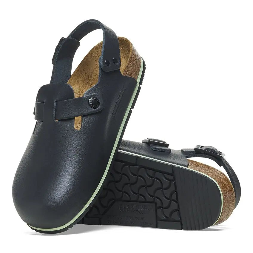 Black clogs with adjustable heel strap, slip-resistant sole, and cork footbed for medical professionals