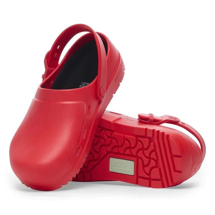Pair of red medical clogs with slip-resistant sole and adjustable heel strap