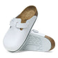 Birkenstock Boston PRO footwear with supportive footbed and tan leather straps, close-up view of the shoe.