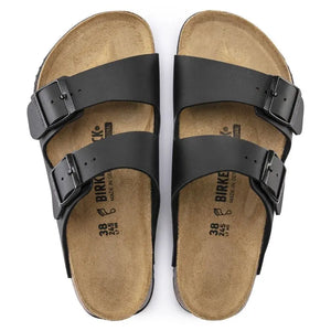 Pair of black two-strap sandals with buckles and cork footbed, top view