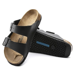 Black two-strap sandals with cork footbed and textured sole, orthopedic footwear
