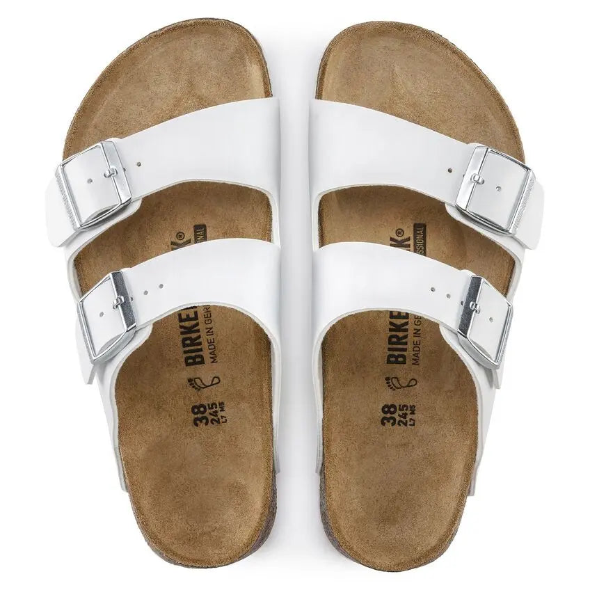 White leather double strap sandals with buckles and cork footbed, top view