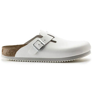 White slip-on medical clog with buckle, closed toe and non-slip sole, side view