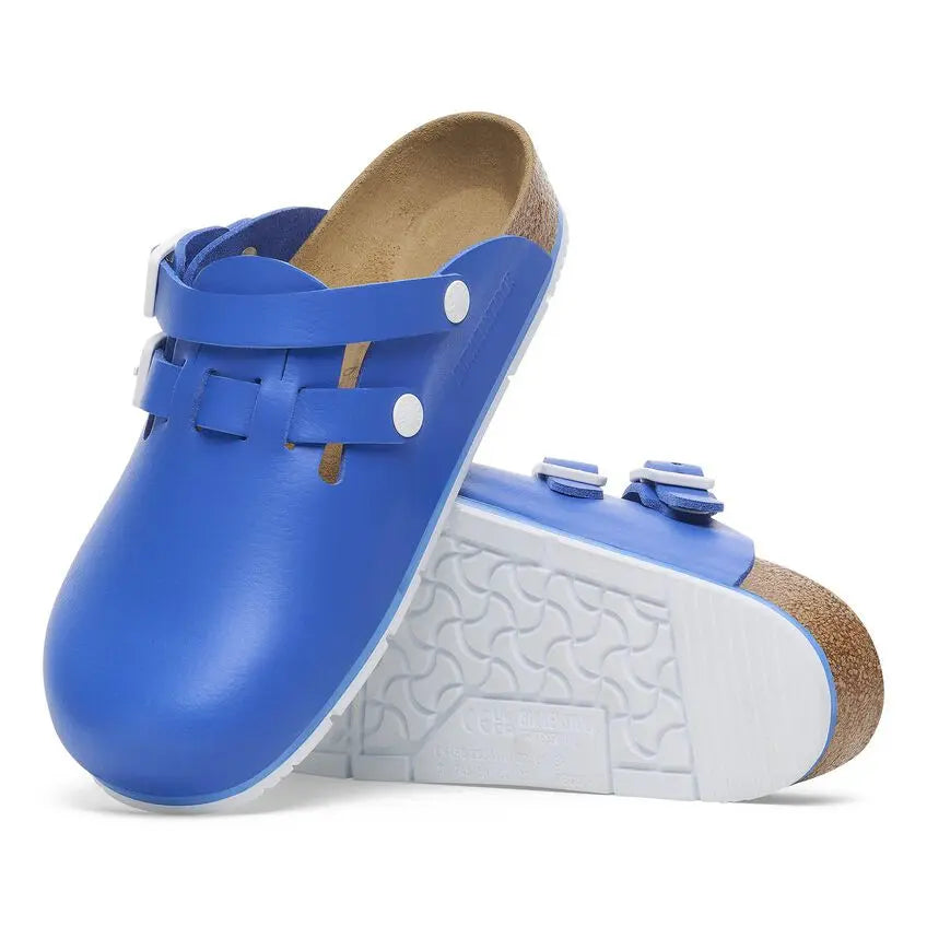 Blue medical clogs with white straps and non-slip sole, ideal healthcare footwear.