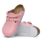 Pink medical clogs with adjustable straps and slip-resistant white soles on white background