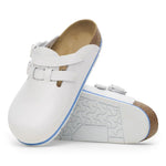 White slip-on medical clogs with adjustable straps, non-slip sole, and cork footbed
