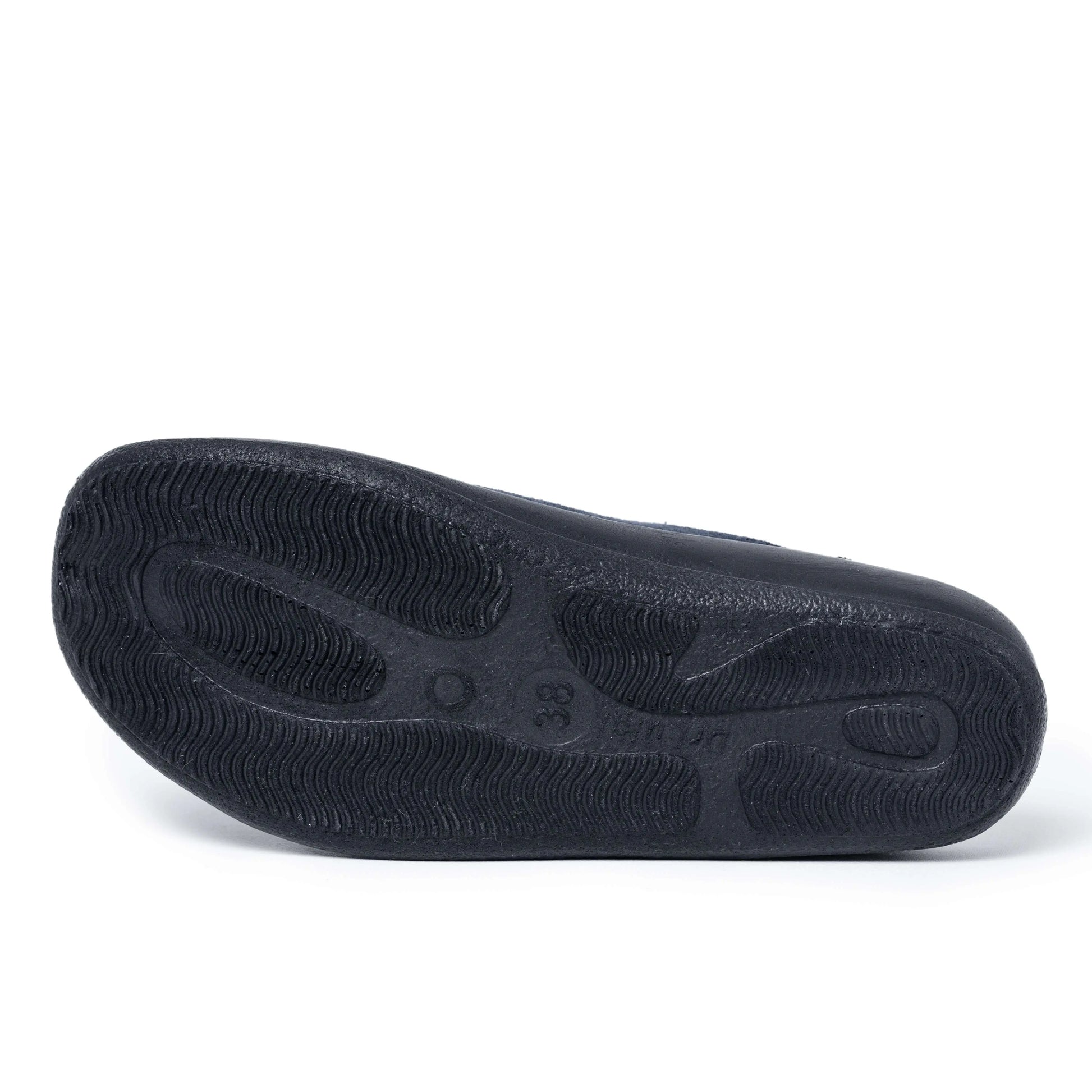 Black non-slip sole of a medical shoe with textured grip, shown on a white background