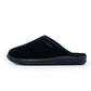 Black orthopedic slipper with closed toe and rubber sole, side view on white background