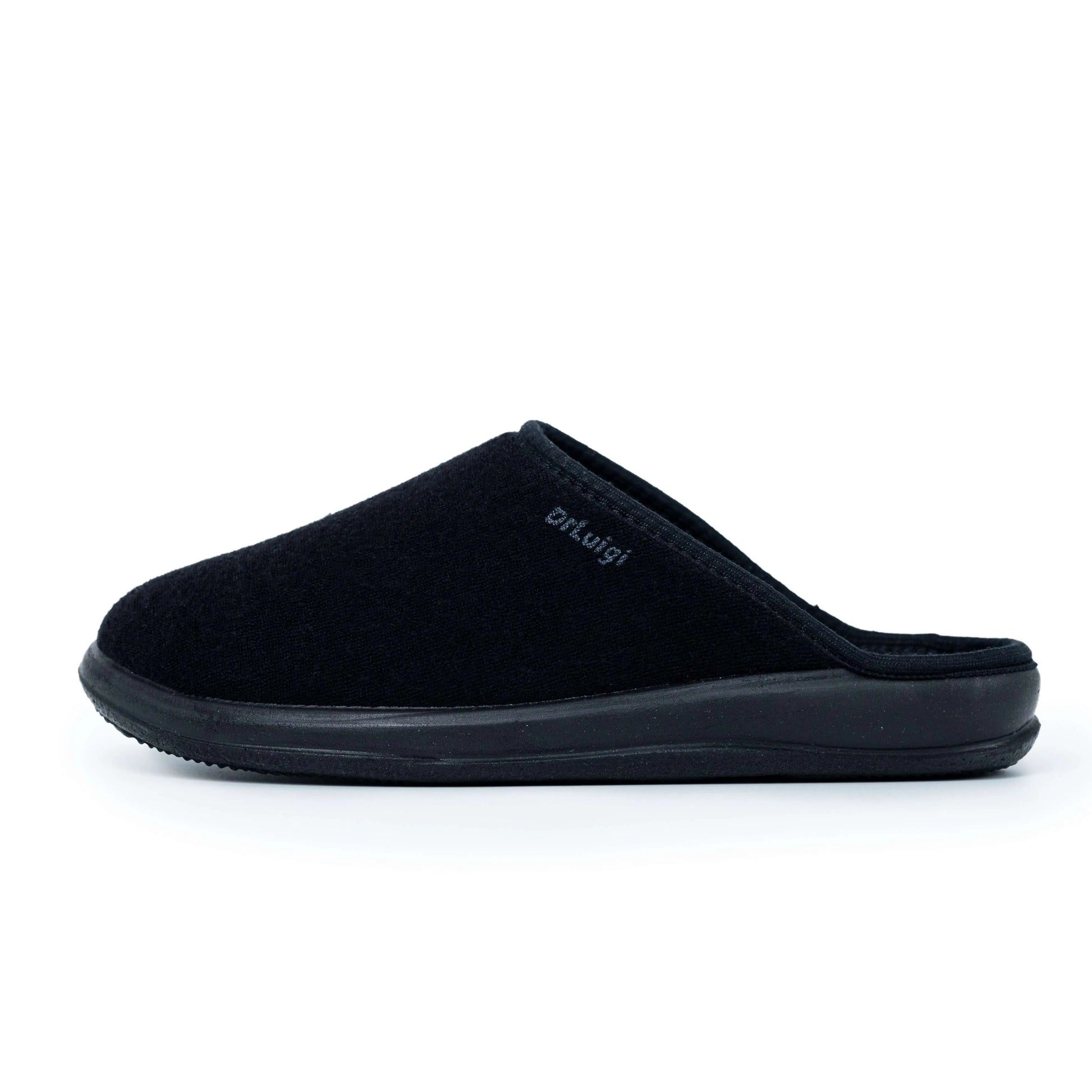 Black orthopedic slipper with closed toe and rubber sole, side view on white background