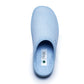 Light blue medical slipper with closed toe, soft fabric, labelled with Dr Luigi, on white background
