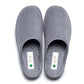 Pair of grey medical slippers with closed toe, slip-on design, and healthcare labels