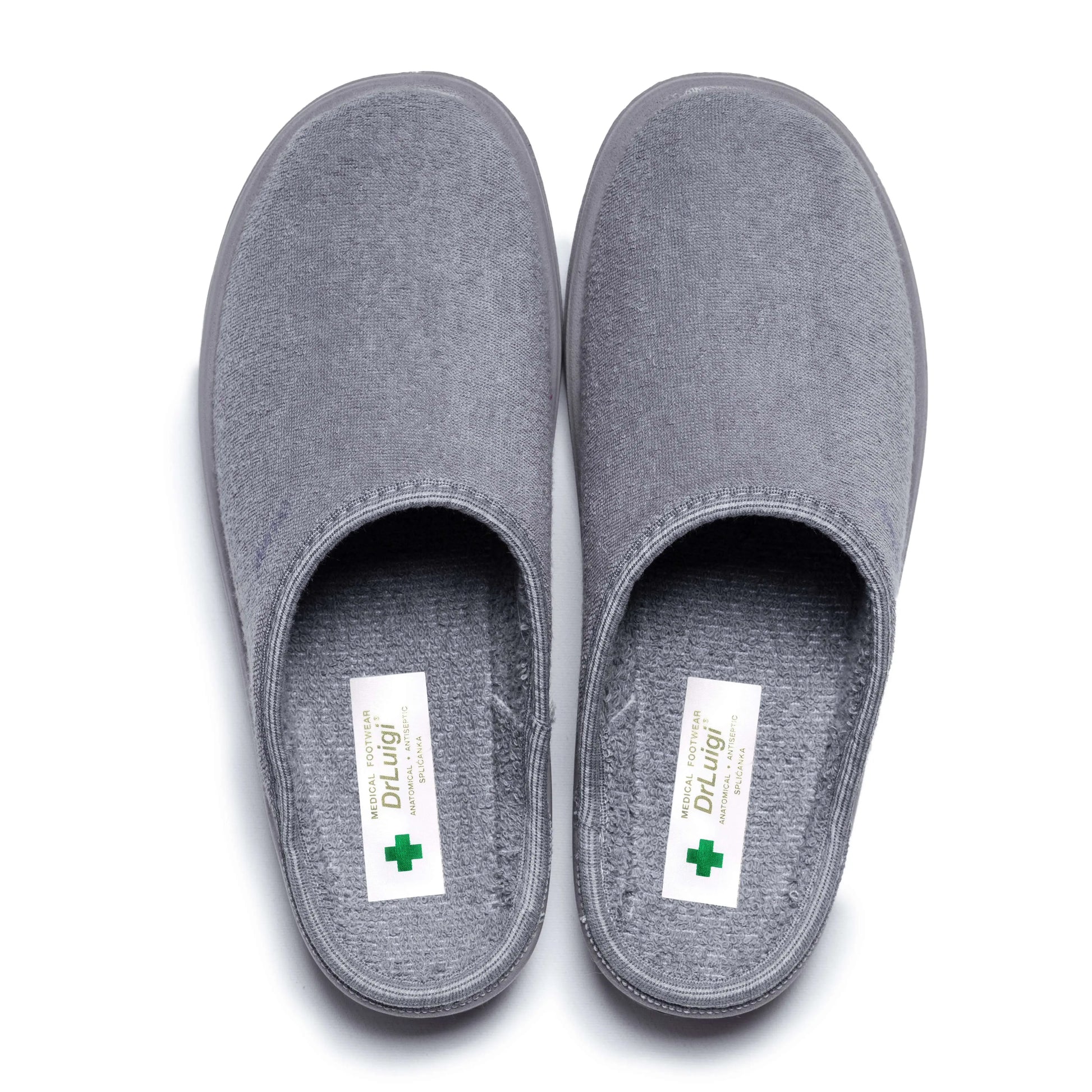 Pair of grey medical slippers with closed toe, slip-on design, and healthcare labels