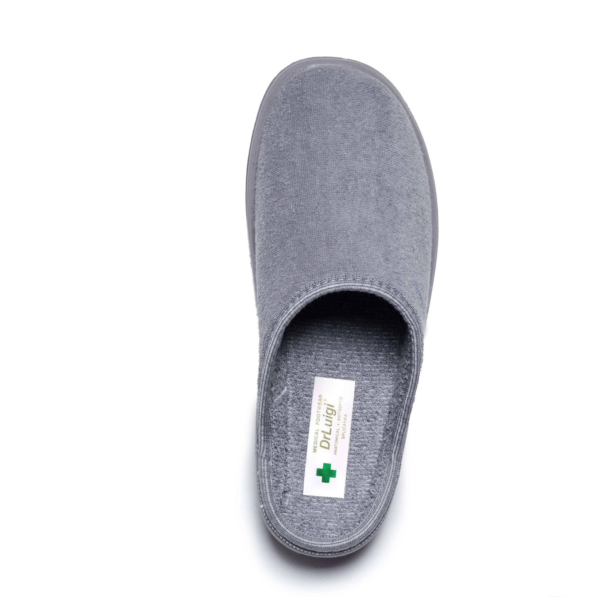 Grey medical slipper with closed toe and soft textile upper, viewed from above on white background