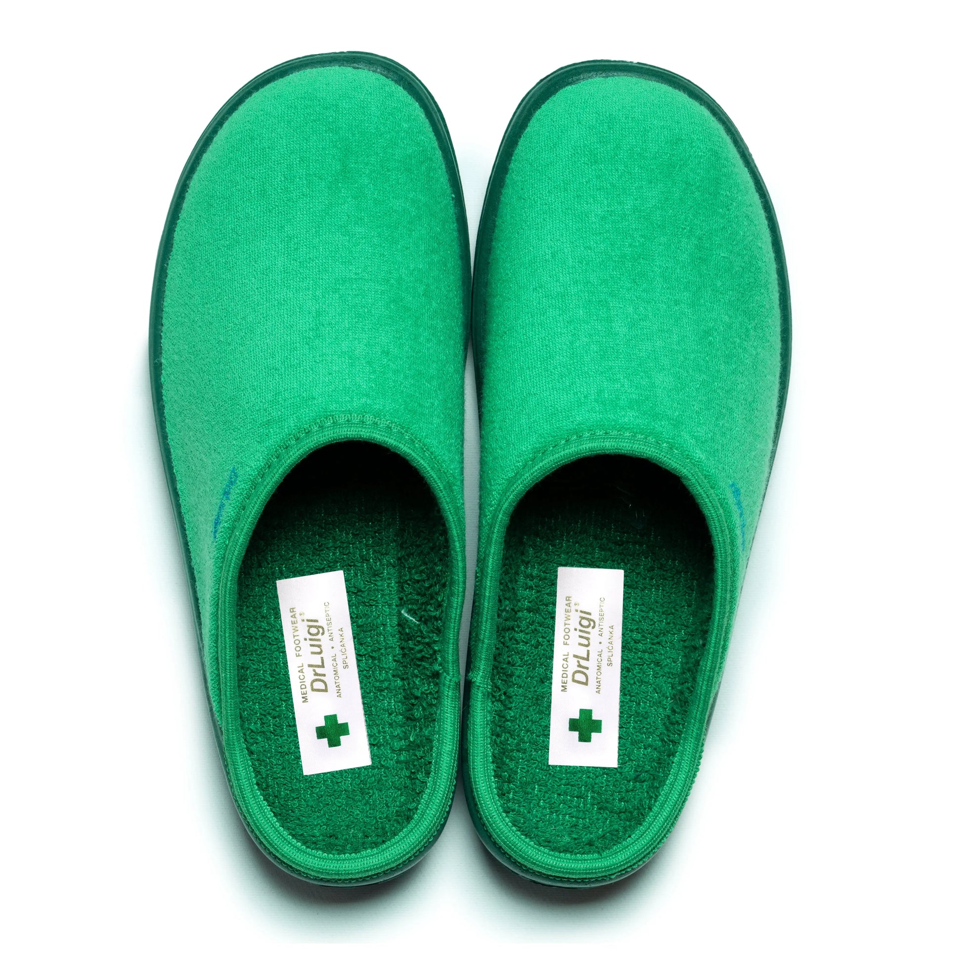 Green medical footwear slippers with soft sole for healthcare professionals on white background