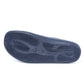 Navy blue non-slip medical shoe sole with textured grip, viewed from the bottom