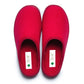 Pair of red medical orthopedic slippers with closed toe on white background
