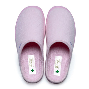 Pair of pink medical slippers with closed toes, soft fabric, and Dr. Luigi label visible inside