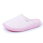 Light pink medical comfort slipper with closed toe and soft cushioned sole, side view