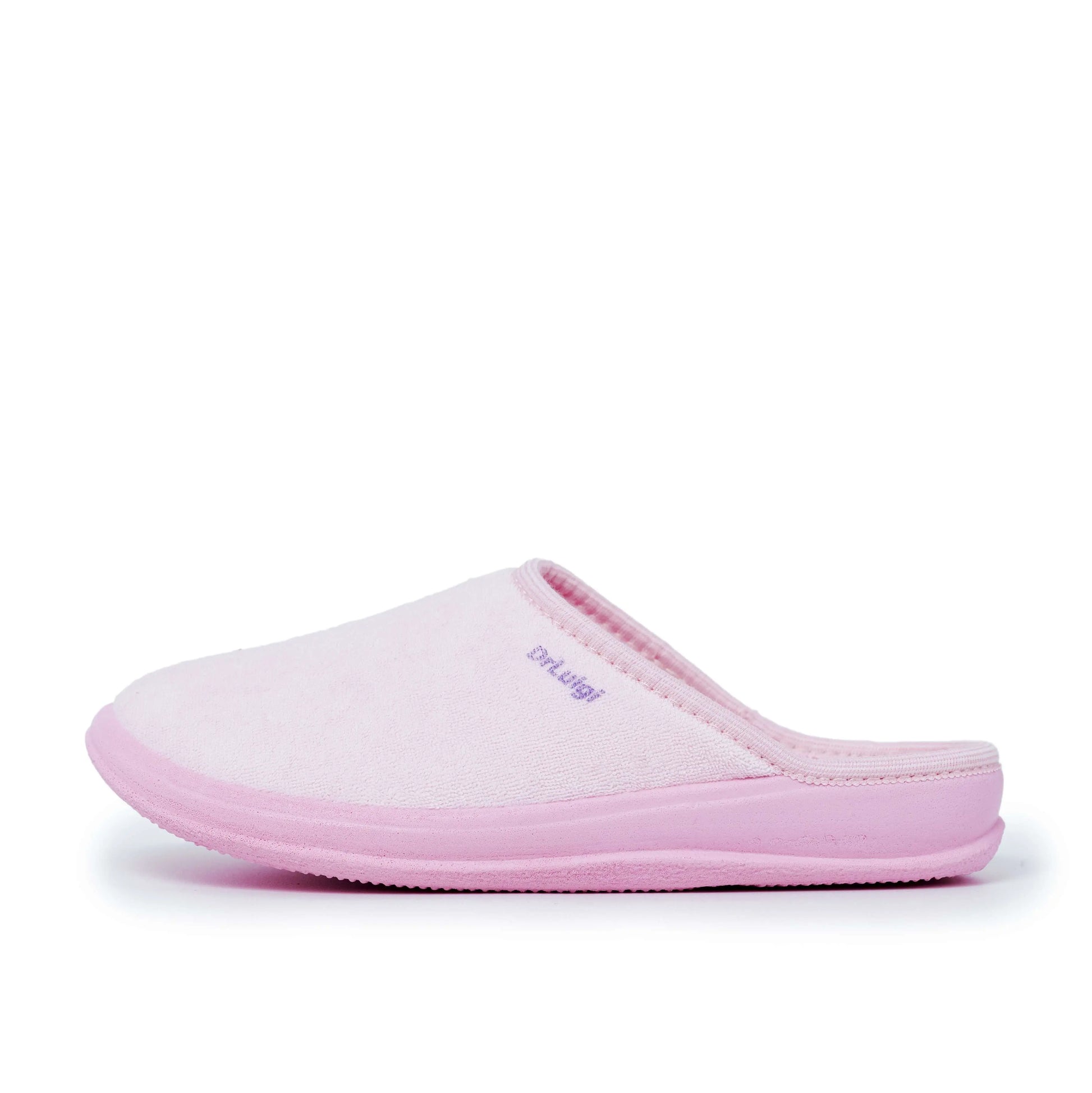Light pink medical slipper with closed toe and slip-on design, side profile view
