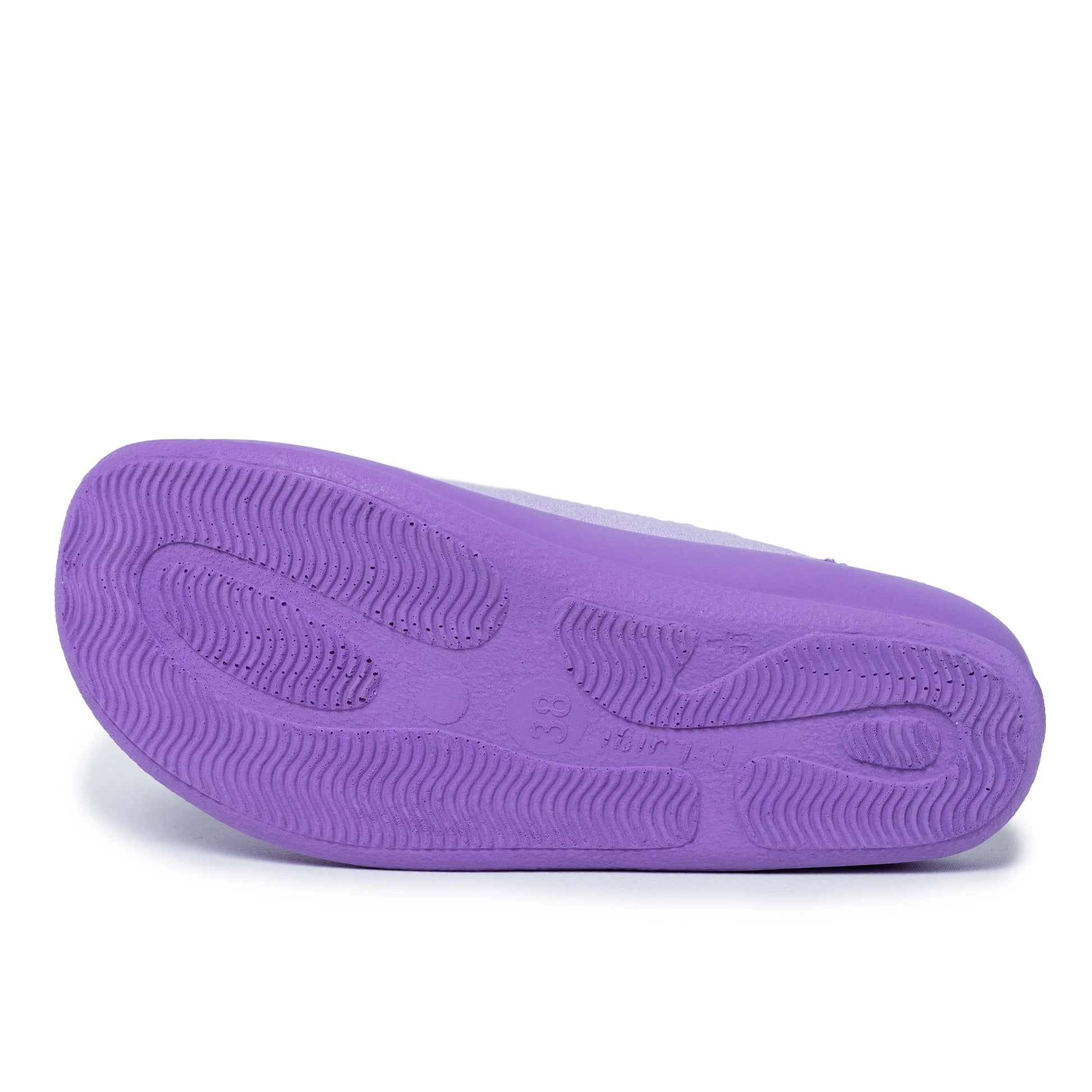 Purple non-slip sole of a medical shoe with textured grip, size 38, on white background