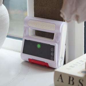 Heart Hero Elliot AED defibrillator with display screen and electrodes, compact emergency medical device for cardiac emergencies.