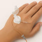 IVG Mini IV Securement Device securing peripheral cannulas, shown in a pack of 150 for IV Glove medical use.