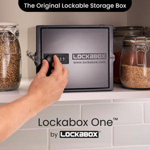Lockabox One™ Jet plastic lockable storage box with transparent sides and secure locking mechanism on a white background