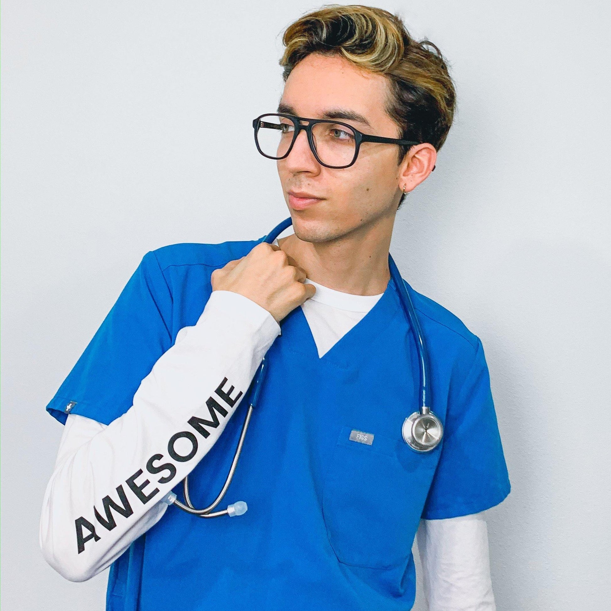 Bright blue MDF Instruments Acoustica® stethoscope displayed in a professional healthcare setting.
