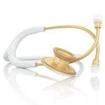 White and gold MDF Instruments Acoustica® stethoscope with dual-head chestpiece and flexible tubing for medical auscultation.