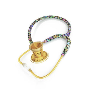 MDF Instruments ProCardial Titanium adult cardiology stethoscope in gold with mermaid-themed tubing, close-up of chest piece and tubing details.