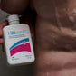 HibiWash antiseptic skin cleansing body wash in 125 ml bottle, shown in a shower setting, designed for skin hygiene and care.