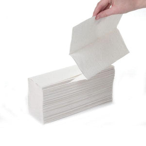 White laminated 2-ply Z-fold paper towels from Northwood, showing folded sheets stacked neatly for commercial use.