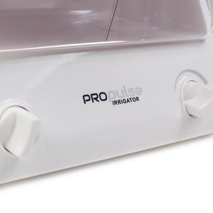 Propulse ear irrigator with purple lid and 10 QrX tips for ear cleaning and irrigation.