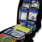 Open black Reliance TraumaFix FREC 3 Kit in tactical rucksack showing first response emergency care supplies and medical equipment.
