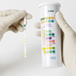 Roche Combur 10 UX urinalysis test strips, 100-pack, with color chart and testing steps shown in the image.