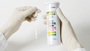 Roche Combur 10 UX urinalysis test strips, 100-pack, with color chart and testing steps shown in the image.