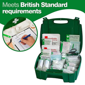 British Standard green first aid kit with assorted medical supplies and checklist